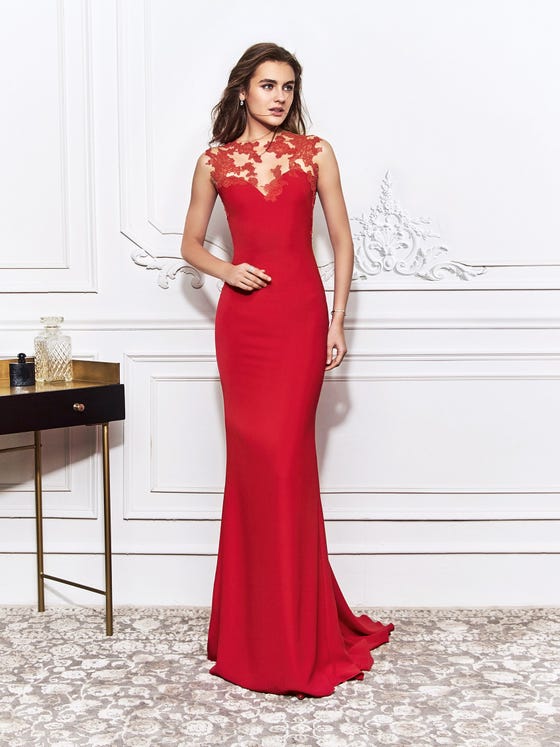 Irresistable mermaid gown crafted in deep scarlett crepe, designed with a beautiful tattoo neckline and lace placements that travel over the cap sleeves into a sexy, scoop back. 