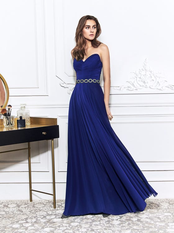 Minimalist gown in navy blue stretch tulle, crafted with an angular sweetheart bodice featuring delicate drapery and finishing in a relaxed sheath skirt. 
