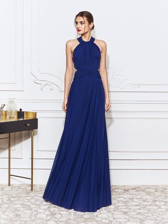 Unique, cross-over braiding reveals just enough skin at the waistline of this sheath gown, crafted in royal blue stretch tulle that forms a halter at the neckline and intersects at an open, keyhole back. 