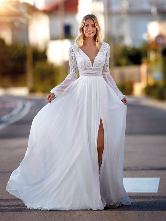 Beautiful flared chiffon dress with a front slit, along with a romantic lace bodice and bishop sleeves combining both fabrics and a provocative V-neck front and back. 