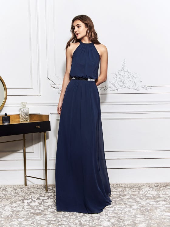 Elegant sheath gown with loose, bishop bodice and halter neckline, finishing in a relaxed skirt of navy blue chiffon.  