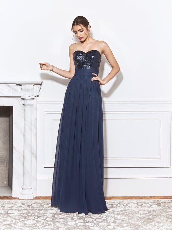Low-volume sheath gown with navy blue, sequined sweetheart neckline, a draped waistband, and a long skirt of soft chiffon. 