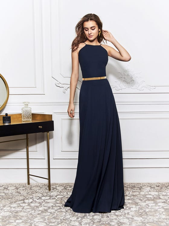 Minimalist sheath gown in navy blue Georgette, cut with an elegant, high neckline and spaghetti straps that circle the shoulders for a chic, barely-there effect on the open back. 
