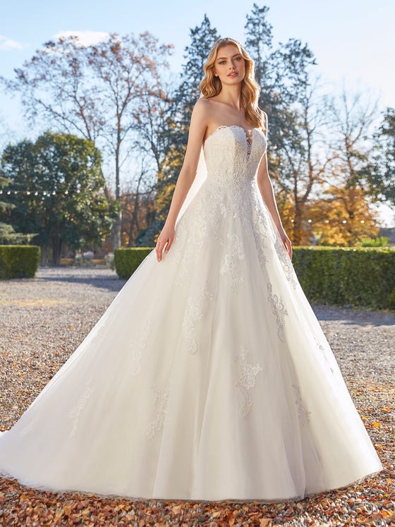 Your prince and carriage await wearing this princess-style dress with a plunge cutaway back and deep sweetheart neckline crafted in butter-soft embroidered tulle.  