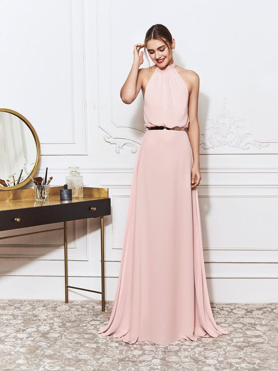 Chic A-line gown in soft pink chiffon, featuring rippling bodice and stylish halter neckline that finishes in a relaxed bow at the back. 