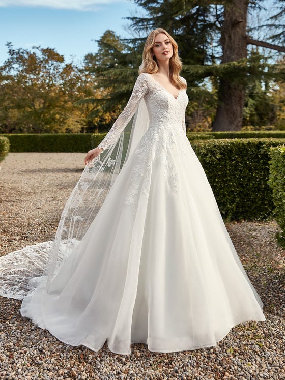 Layers of silky organza create a magical Princess-style gown embellished with beautiful floral embroidery and a lace bodice with deep V cleavage and back.  