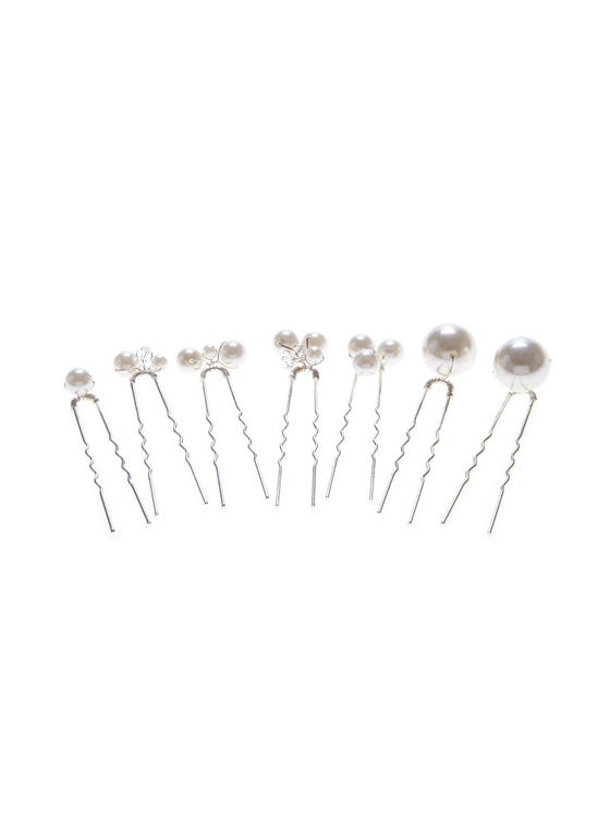 Set of glossy pins with spherical pearls of different sizes 