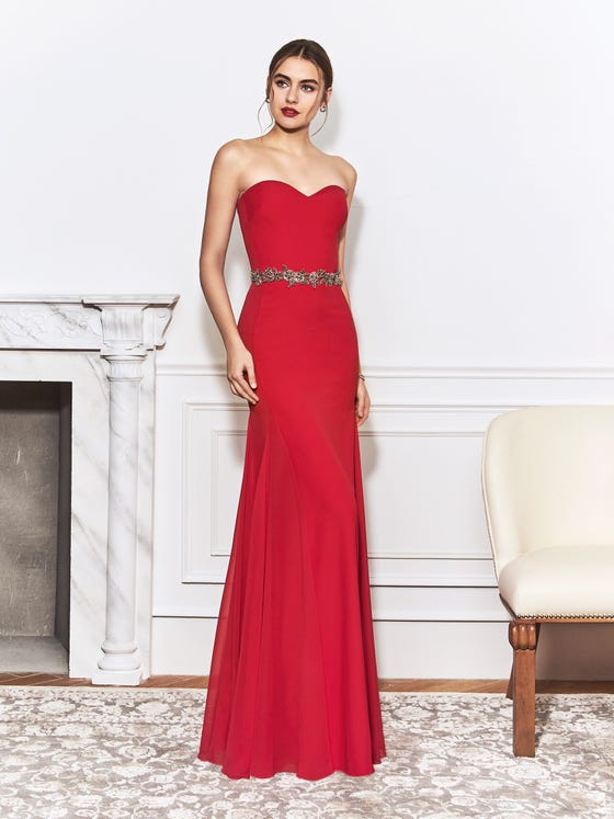 Scarlet gown featuring a strapless sweetheart neckline and a flattering, fitted skirt, cut with tulle panelling for extra movement. 