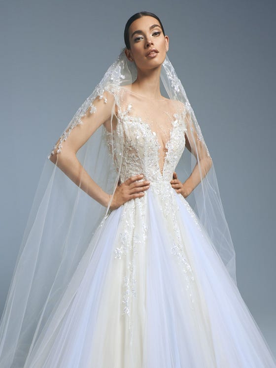 Spectacular glimmery tulle veil with a beaded floral design that cascades down from the elbows. 